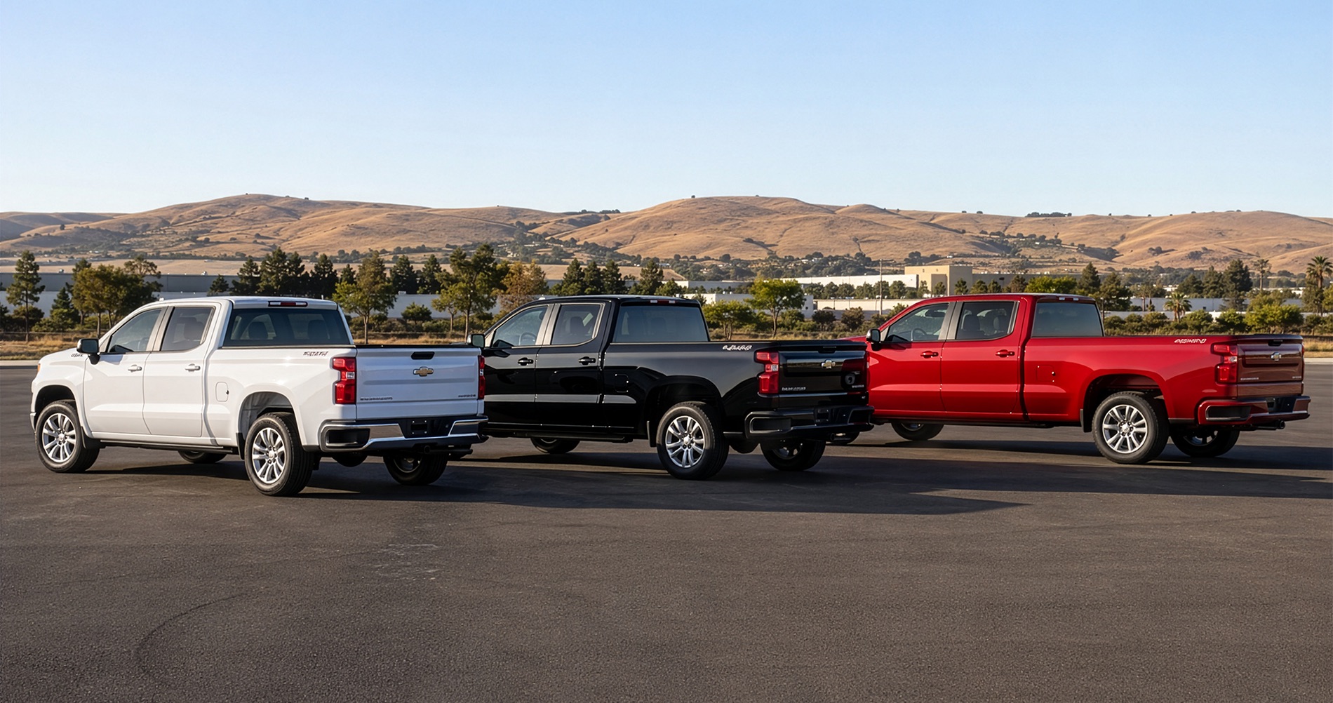Three 2026 Chevrolet Silverado 1500 trucks showing different cab and bed size configurations